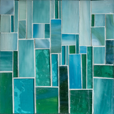 Teal glass and grout on wood