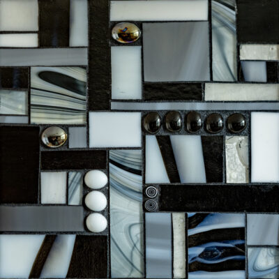 Gray and black glass and grout on wood