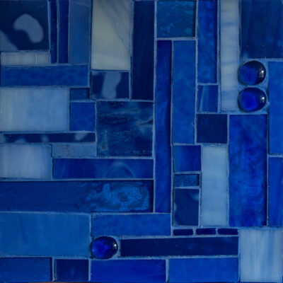 Blue glass and grout on wood.