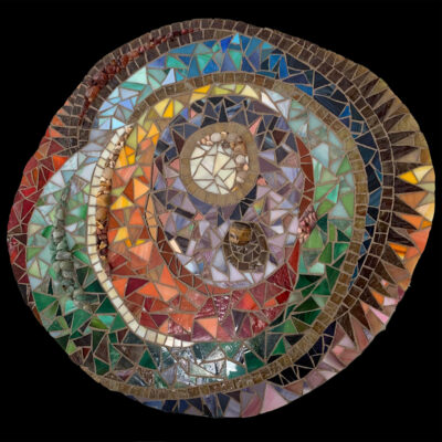 glass, stones, and grout on wood