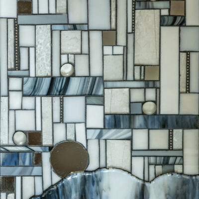 Light blue glass and grout on wood